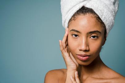 Beauty Tips For Lupus Calm young ethnic woman with perfect skin touching face after shower